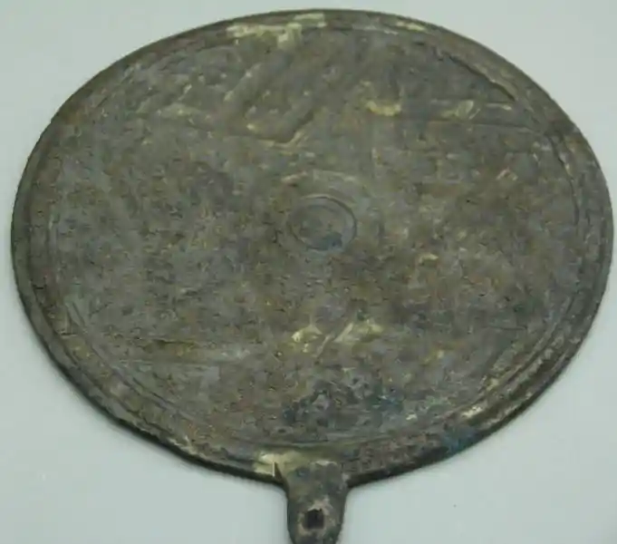 Six-pointed star engraved on a bronze badge